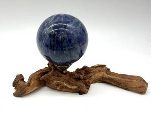 lot 90 image: Sodalite Sphere on Driftwood Stand