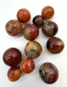 lot 141 image: Polished Agate Spheres - Orange & Red Banding