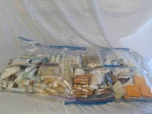 Multiple bags of soaps, conditioner and shampoos