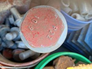 Bucket of large bolts