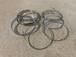 lot 57 image: LOT OF 7 Silver Tone Bangle Bracelets