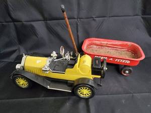 lot 36 image: Vintage Yellow Tin Toy Car & Red Radio Flyer Wagon - Beam 100 Months Old Plaque Inside