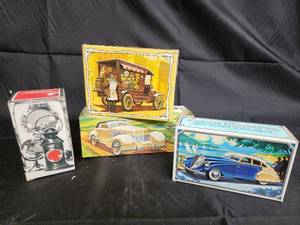 lot 45 image: Captains Lantern After Shave 7 FL OZ - Vintage Tin Car Toy Boxes (Lot of 4)