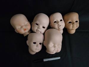 lot 110 image: Unpainted Ceramic Doll Heads - 5 Heads for Doll Making