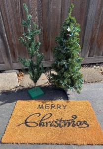 Two Small Artificial Christmas Trees & Merry Christmas Doormat
