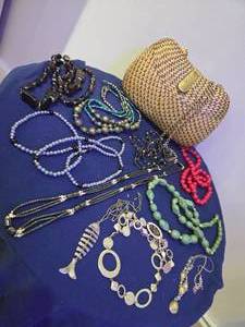 Wicker clutch with necklaces