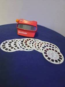 Variety of Vintage toys and collectibles- Thomas the Train, 7-eleven AW car, 2 Piece Royal Doultan Bunny ware, View Master, Vintage Coca Cola Bottle Opener, Book of stamps, Speak & Math Texas Instrument Calc.