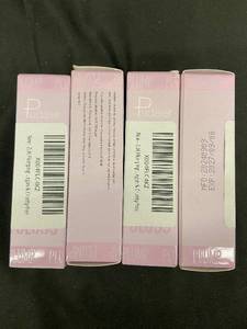 lot 126 image: Plump Lip Color - 4 Boxes, Coral Shade, PinkPurple Packaging