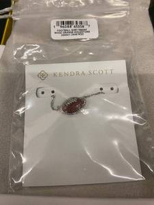 lot 156 image: Kendra Scott Football Pendant - Orange Goldstone