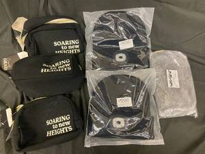 lot 176 image: Graduation Gift Set - Soaring to New Heights Black Pouches & Sealed Garments