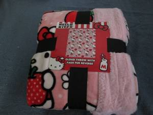lot 25 image: Hello Kitty plush throw...