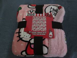 lot 26 image: Hello Kitty plush throw...