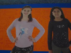 lot 93 image: 2 Girls Favorite Tee size 10-12...