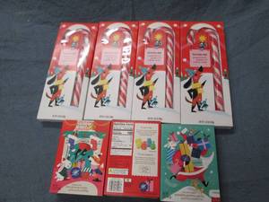 4 Jumbo candy canes and 3 holiday a...
