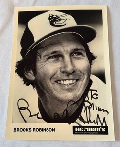 lot 48 image: Brooks Robinson Autographed Baseball Photo w JSA COA
