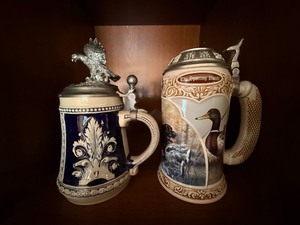 Pair of Lidded Ceramic Beer Steins Eagle Finial & Sporting Breeds