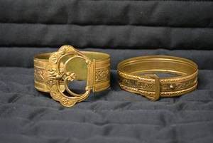(2) metal bracelets...