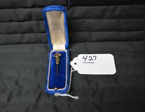 Lapel pin in blue box...