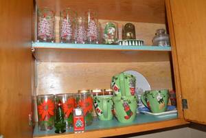 Christmas dishes in both cupboards...