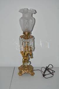 Brass electric lamp with cherub fig...