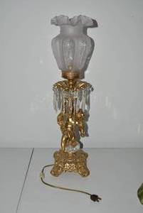Brass electric lamp with cherub fig...