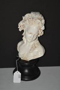 Bust of young maiden with leaves an...