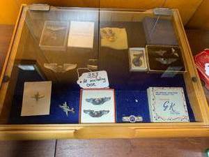 Military insignia pins with case...