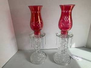 (2) Cranberry glass candle holders ...