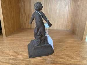 Cast iron door stop of child...