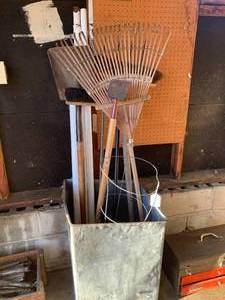 Metal box with yard and garden tool...