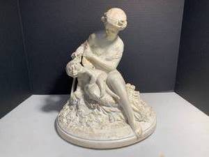 Woman seated tending to a child, 14...