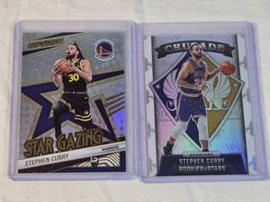 Lot of 2 Stephen Curry Basketball Cards including Panini Revolution Star Gazing and Rookies & Stars Crusade Holo.