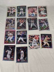 Lot of 14 Baseball Rookie Cards Featuring Adley Rutschman, Evan Carter, and Colton Cowser. Includes various brands with special features like holographic and holiday designs.
