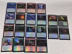 Lot of Magic The Gathering Foil Cards Including Steelfin Whale, Faithless Salvaging, and Kitchen Imp