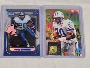 Lot of 2 Barry Sanders Football Cards featuring Playoff Momentum and Fleer Ultra Hot Numbers