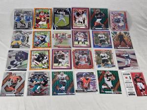 Lot of 24 Inserts and Relic Football Cards Featuring Players Like Lamar Jackson, Justin Herbert, and Trevor Lawrence. Includes Rookie Cards and Special Inserts.