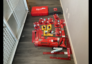 LOT OF Assorted Milwaukee Merchandise (Milwaukee 2306-22 M12 Hammervac Universal Dust Extractor Kit, Nut Driver, Air Tips, Batteries, Tool Box Foam Insert & More)