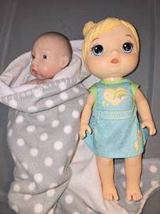 2 Baby Dolls, One is an Anatomically Correct Boy and Baby Alive- Change and Play