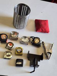 Lot of Hand Tools including Tape Measures, Metal Clamp, and Metal Holder
