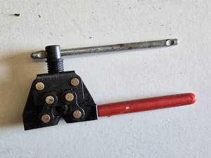 Chain Breaker Tool with Red Handle and Adjustable Screw