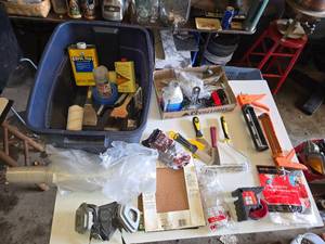 Assorted Painting and Home Improvement Tools including Brush Cleaner, Caulk Gun, and Respirator