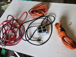 Extension cords with outlet box and cables