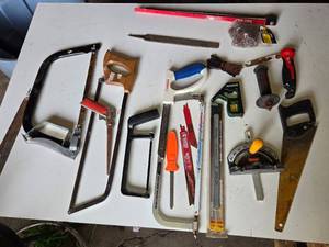 Assorted Hand Tools including Hacksaws, Hand Saws, and Measuring Tools