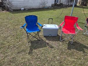 Blue and Red Folding Camp Chairs with Rubbermaid Wheeled Cooler