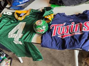 Green Bay Packers Favre #4 Jersey, Minnesota Twins Shirt, and Minnesota Wild Candle Holder