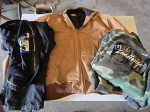 Carhartt Jacket 4XL, Camo Coveralls XL, and Black Snow Pants