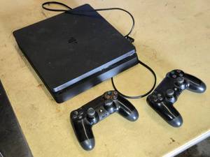 Sony PlayStation 4 Console with DualShock Controllers - Powers On, Needs a Cleaning
