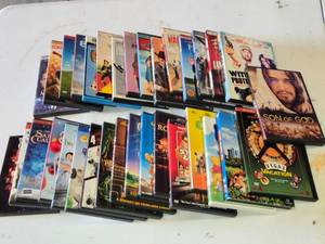 Lot of DVDs including Son of God, Lucky # Slevin, and Mean Girls with various genres and classics