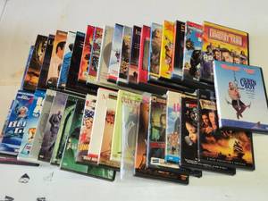 Collection of DVD Movies Including Cabin Boy, Pirates of the Caribbean, and The Longest Yard