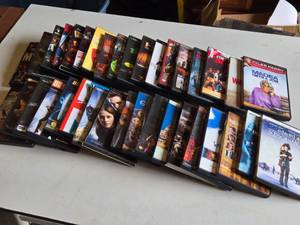 Lot of DVDs including Pirates of the Caribbean, Inception, and Edward Scissorhands, among others